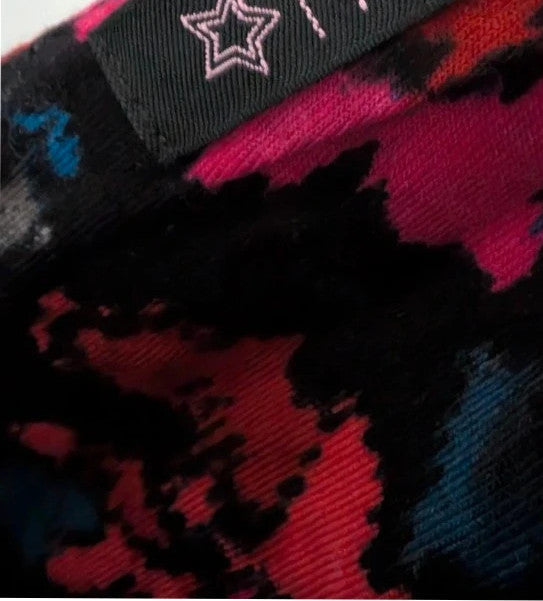 Rise black linen maxi dress with vibrant pink floral print and twist front V-neck.