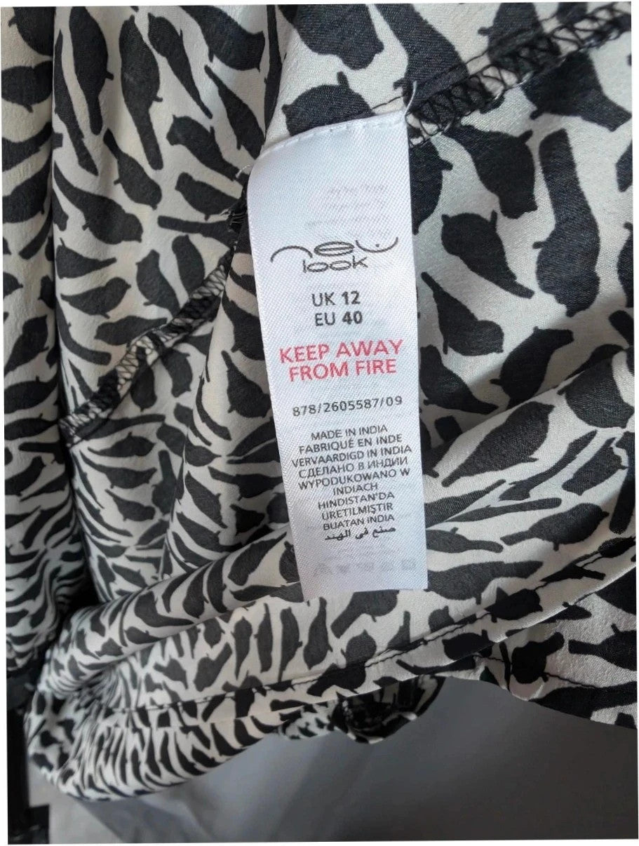 New Look black and white bird print mini dress with lace Peter Pan collar.