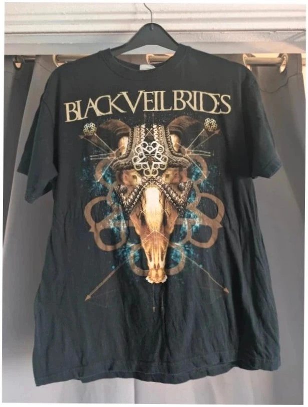 SG black graphic t-shirt featuring ornate goat skull design and distressed cream logo.