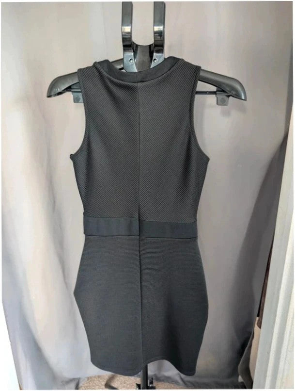 River Island black bodycon mini dress with ribbed texture and midriff cut-out detail.