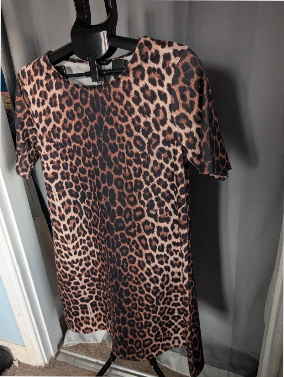 Peacocks leopard print shift mini dress in black and brown with scoop neckline and short sleeves.
