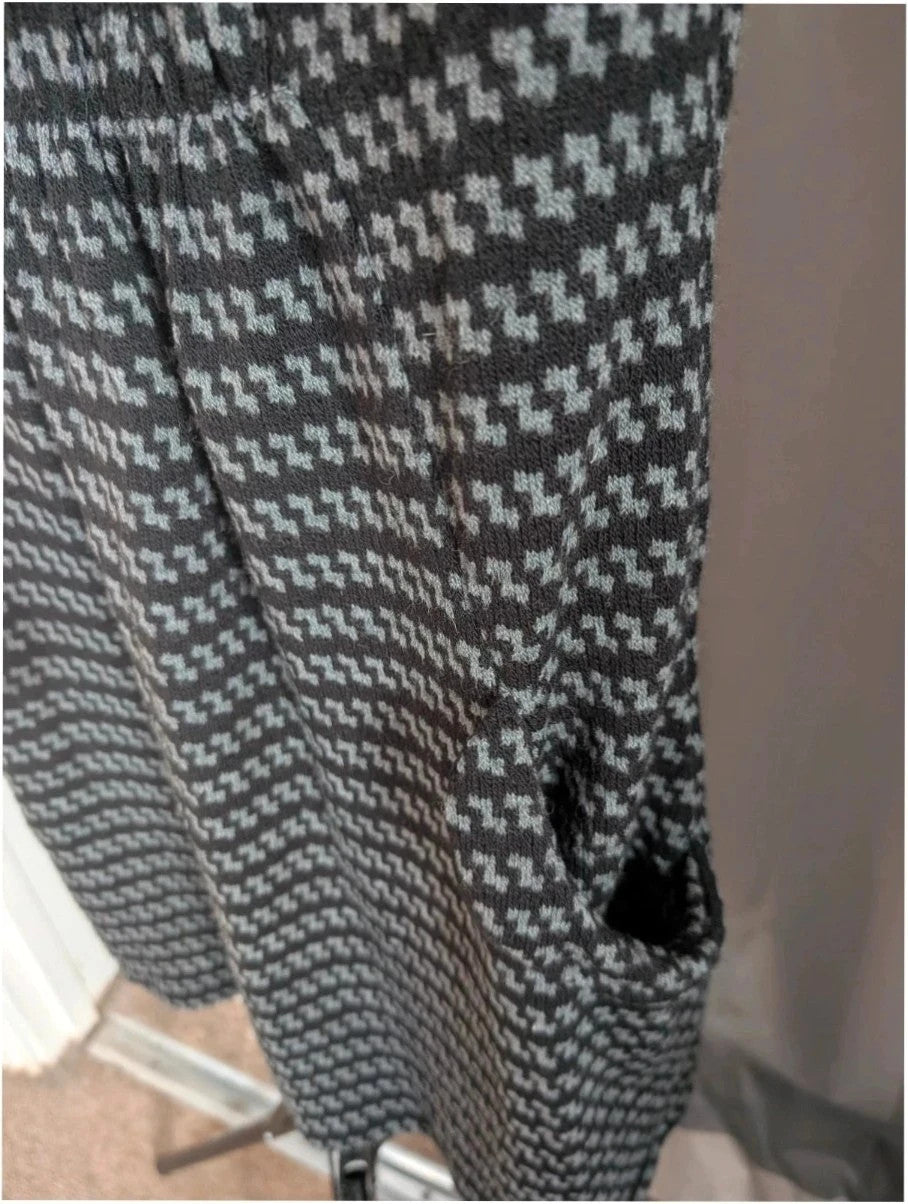 Apricot black and grey knit tunic dress with cowl neck and geometric pattern.