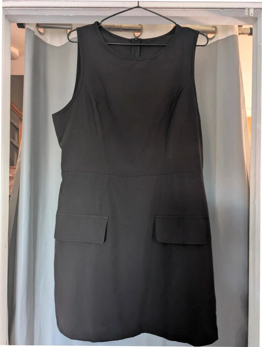 SHEIN black sleeveless mini dress with front flap pockets and back zip fastening.