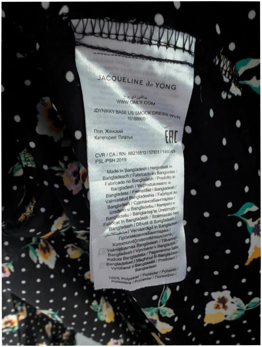 JDY black smock mini dress with floral and polka dot print, long sleeves, and keyhole back.