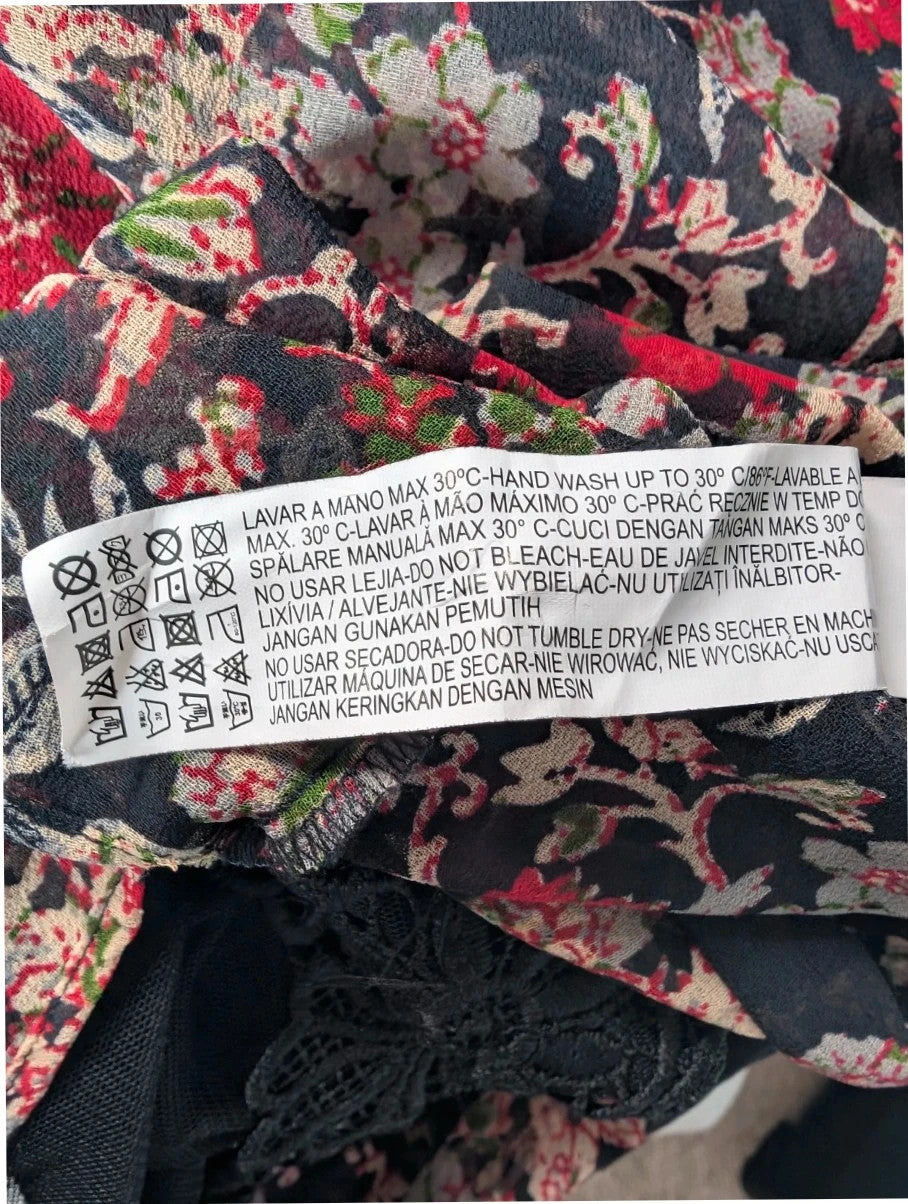 Zara black floral chiffon tunic blouse with tiered ruffle bib and crochet lace details.