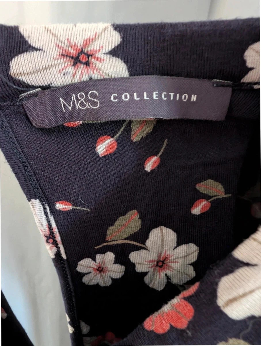 M&S COLLECTION navy blue floral mini dress with high neck and long sleeves.