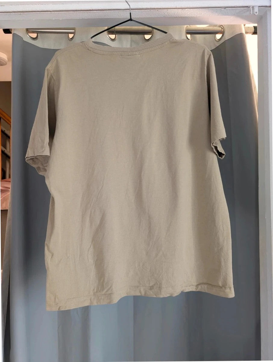 Kiss beige pocket t-shirt with rhinestone logo and band photo graphic.