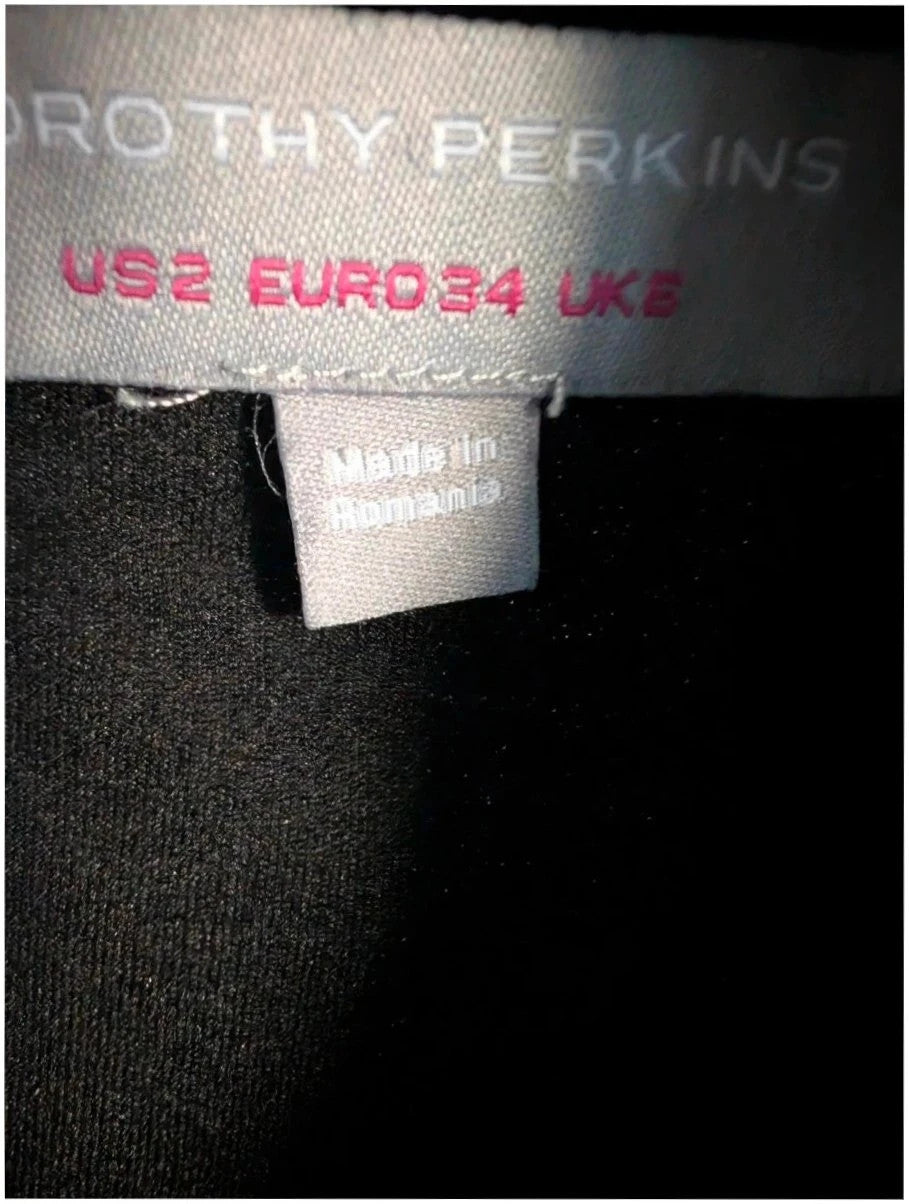 Dorothy Perkins black and white houndstooth shift dress with sleeveless design and back keyhole.