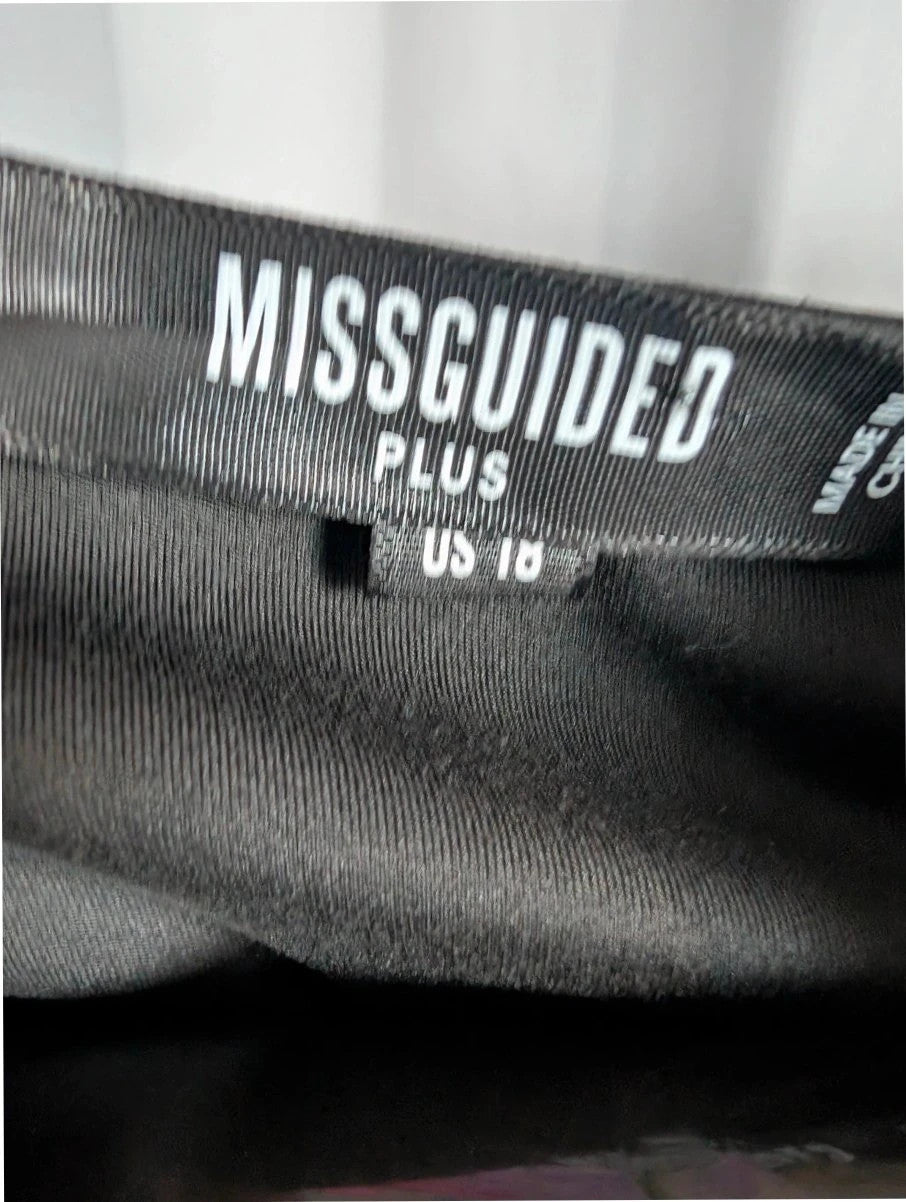 Missguided Plus black cropped gym top with white graphic logo and crew neckline.