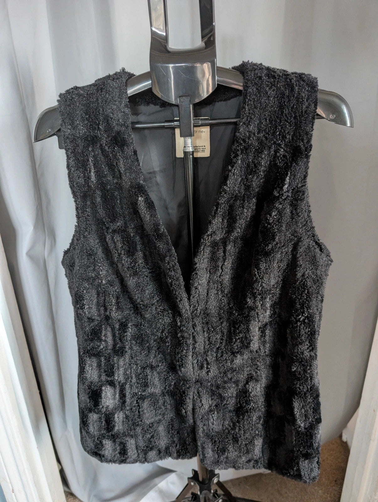 Next black textured faux fur gilet waistcoat with plush waffle pattern and deep V-neckline.