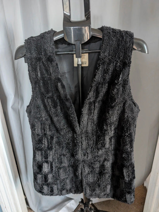 Next black textured faux fur gilet waistcoat with plush waffle pattern and deep V-neckline.