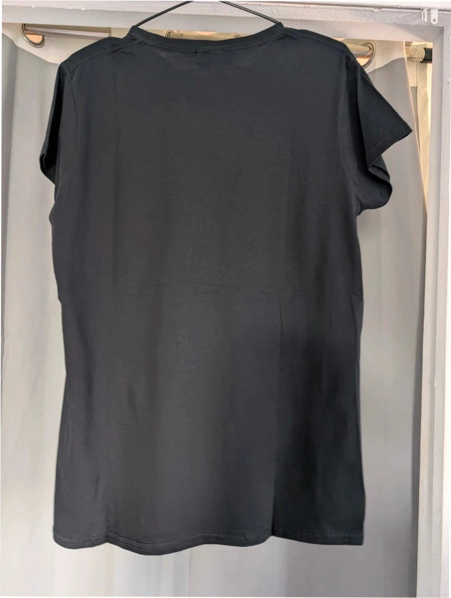 Supernatural black pocket t-shirt with "Stay Inside Salt Circle" graphic and symbols.