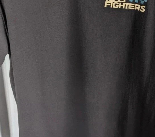 Foo Fighters black graphic tee featuring coiling snake design and blue checkerboard pattern.