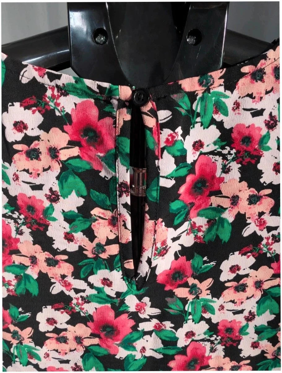 Papaya multi floral mini dress with ruffle shoulders, tiered hem, and keyhole back.