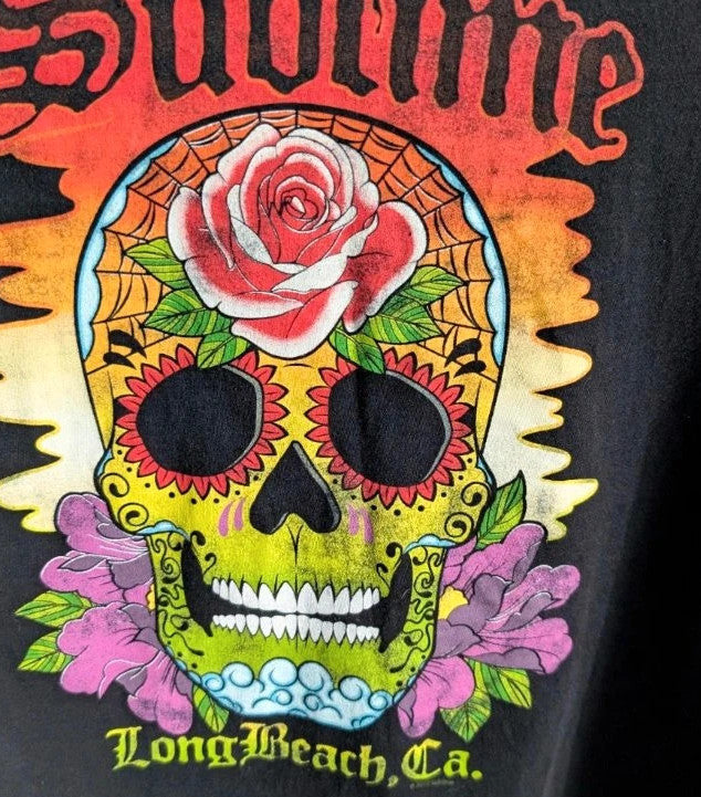 Sublime black graphic tee featuring vibrant sugar skull print, red rose, and gothic lettering.