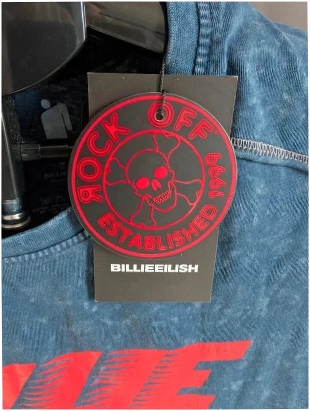 Billie Eilish blue acid wash pocket t-shirt with multicolour graphic and red text.