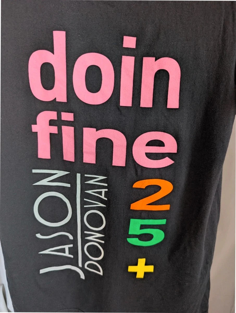 Official Jason Donovan black graphic t-shirt featuring Doin' Fine 25+ tour print and concert dates.