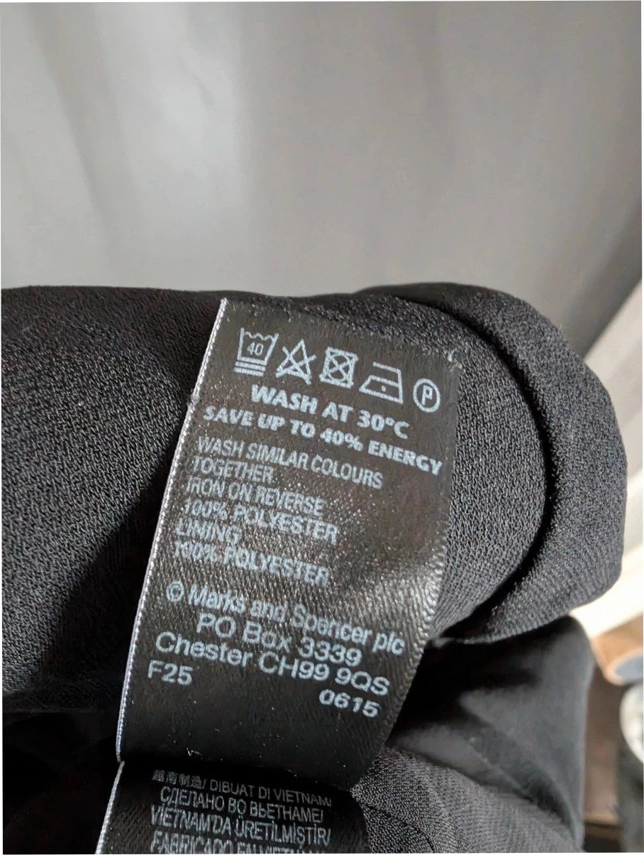 Marks & Spencer black blazer jacket with ruched sleeves and collarless design.