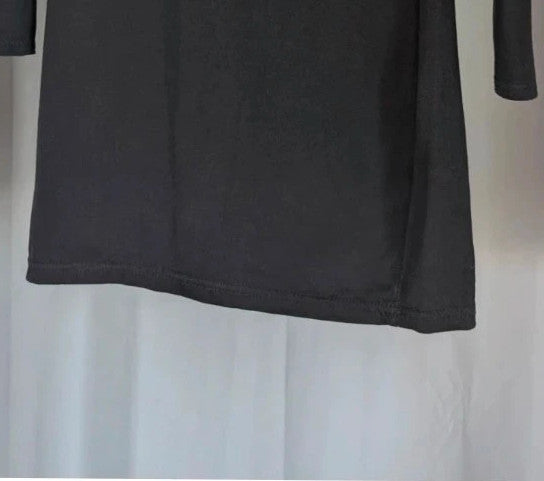 PrettyLittleThing black long sleeve bodycon mini dress with notch neck and fitted sleeves.