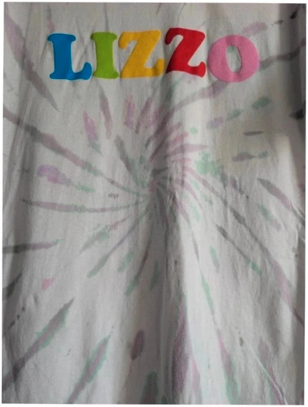 Lizzo Official Merch graphic t-shirt, white with pastel tie-dye and foam puff print logo.