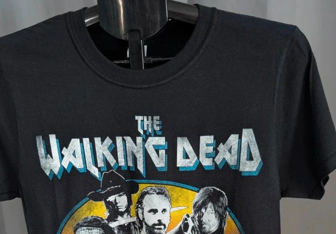 The Walking Dead black graphic tee featuring Rick, Daryl, Michonne, and Carl.