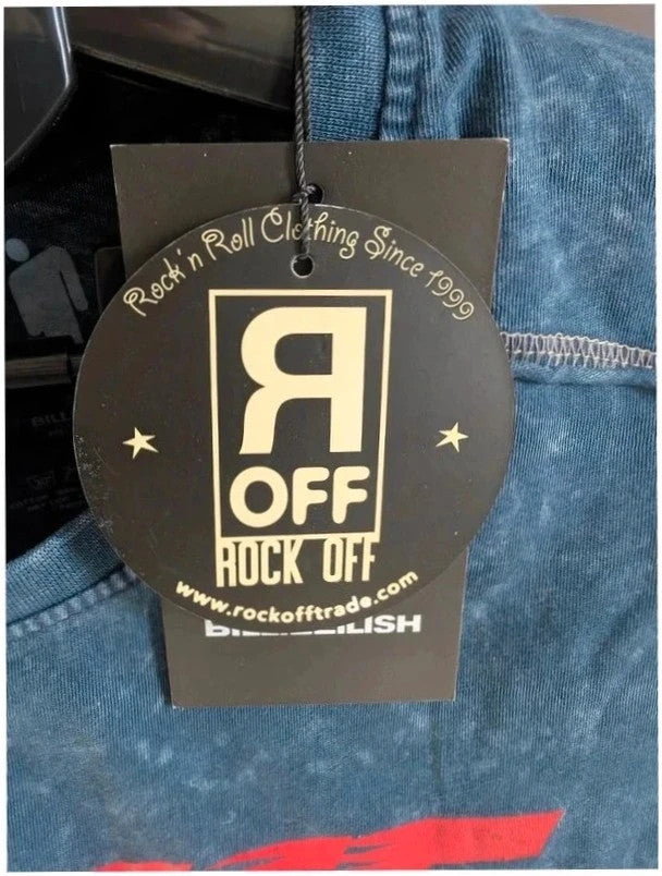 Billie Eilish blue acid wash pocket t-shirt with multicolour graphic and red text.