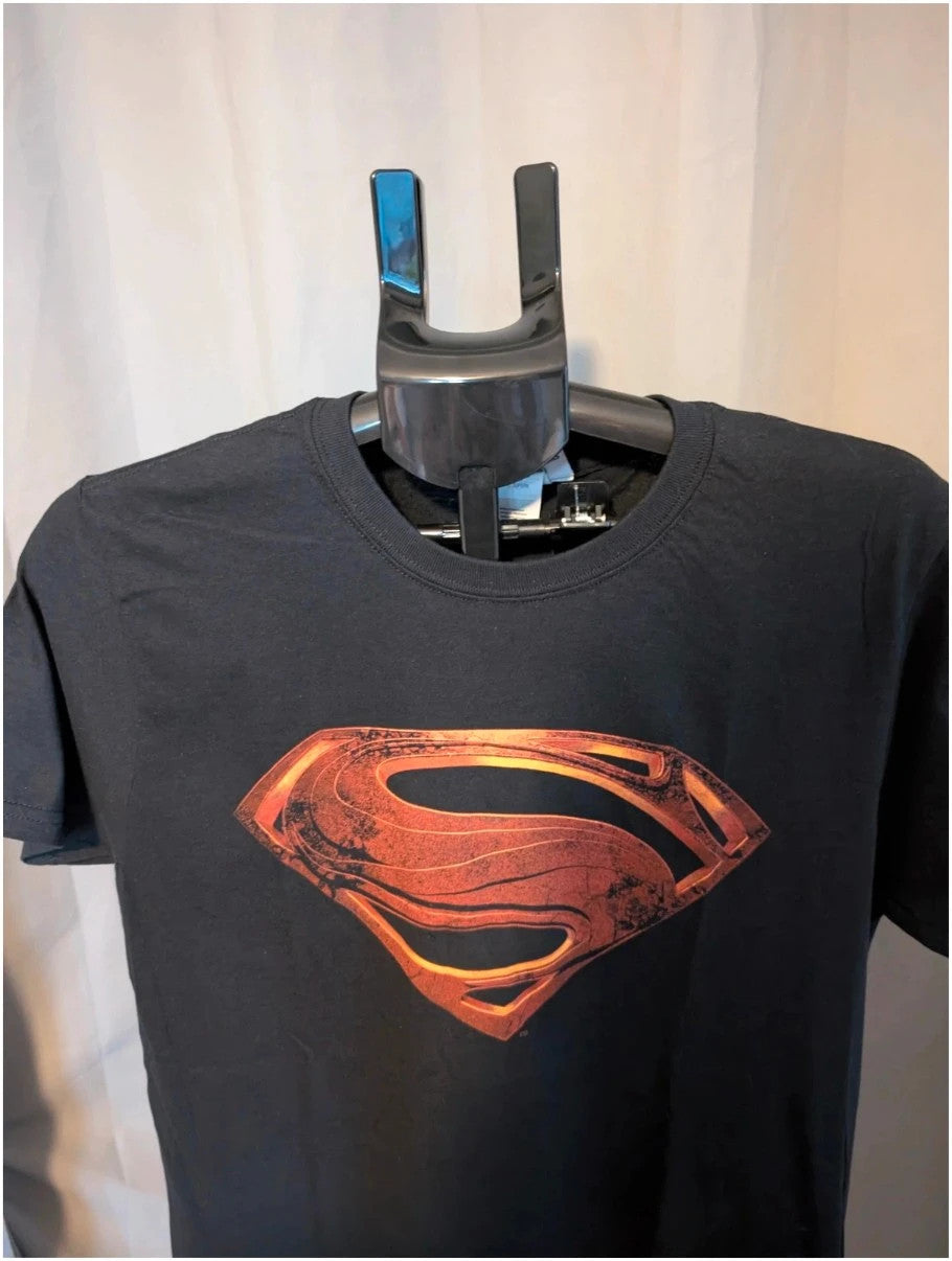 Superman black graphic tee with distressed metallic orange shield logo on soft cotton.