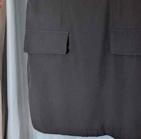 SHEIN black sleeveless mini dress with front flap pockets and back zip fastening.