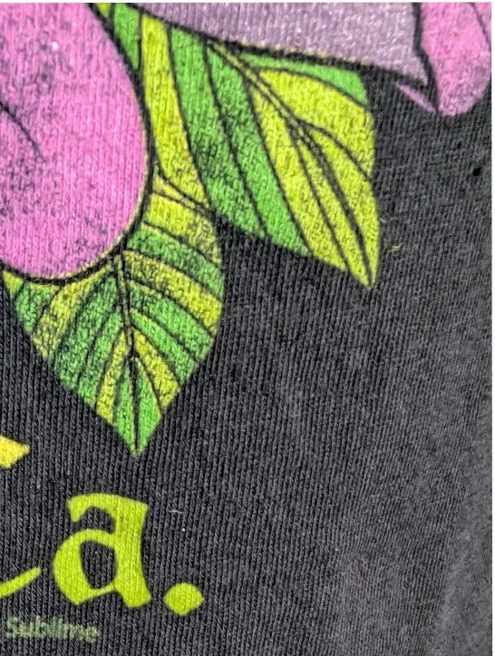 Sublime black graphic tee featuring vibrant sugar skull print, red rose, and gothic lettering.