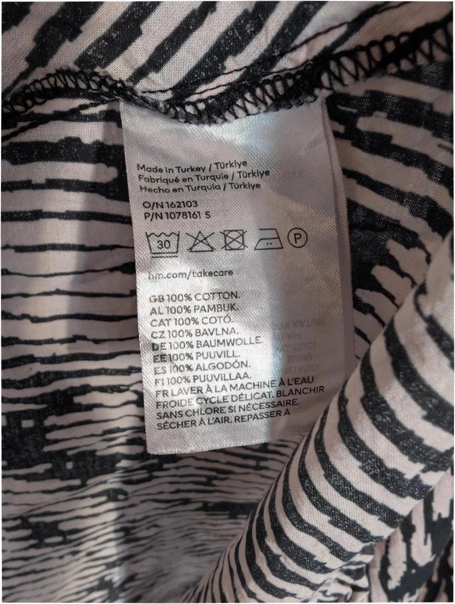 H&M oversized tunic top black white abstract print, round neckline, long sleeves, breathable cotton.
