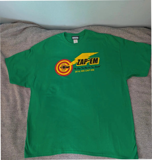 Gildan green graphic tee featuring Men In Black "Zap-Em Exterminators" logo and slogan.