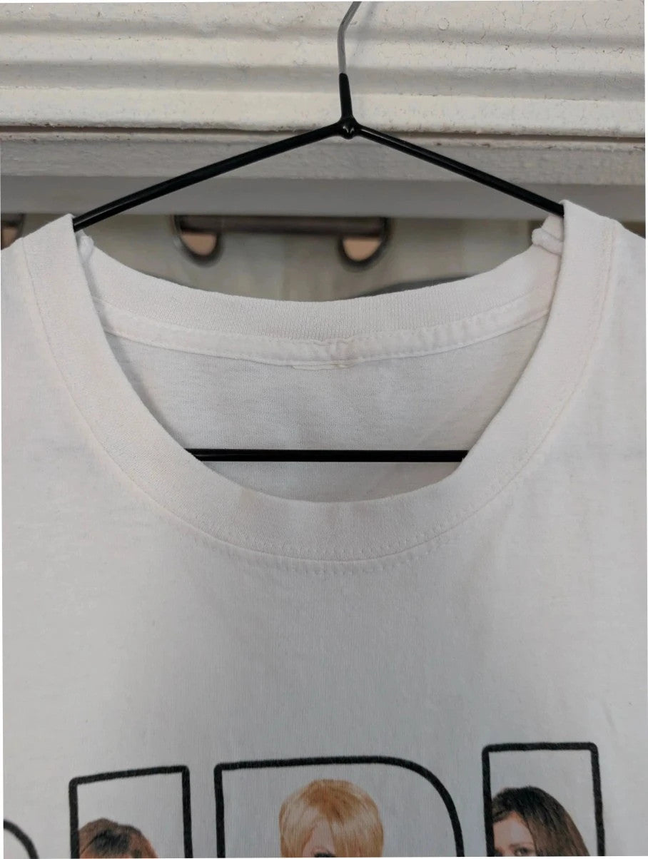Y2K white pocket t-shirt featuring Girls Aloud band graphic and typography print.