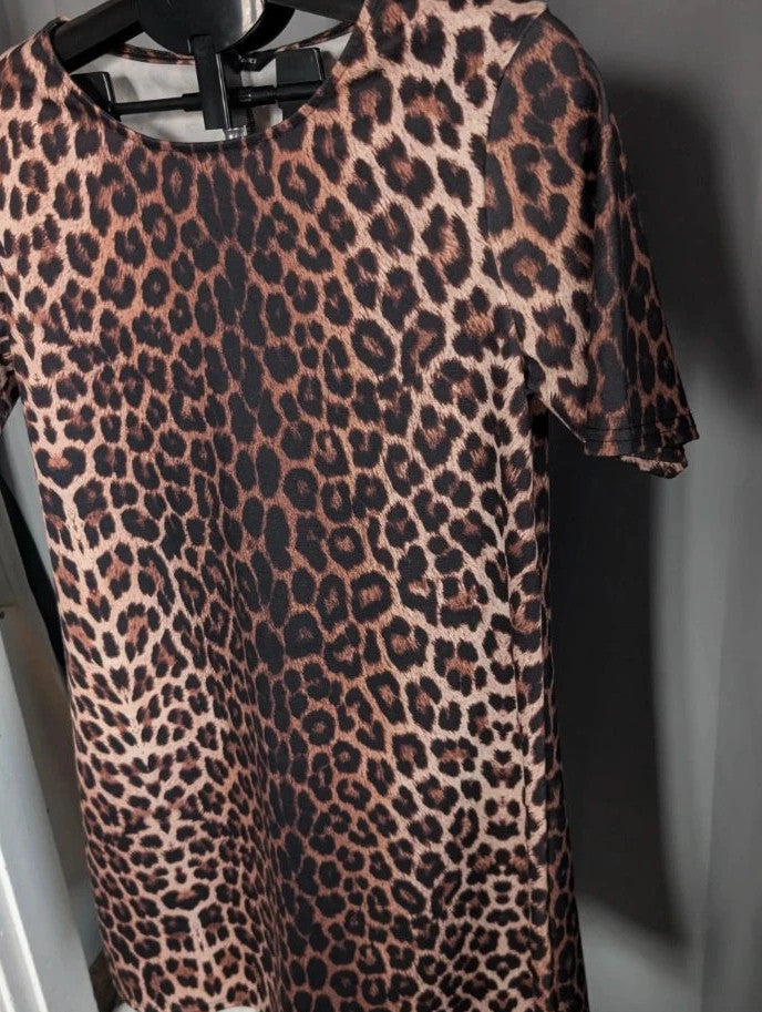 Peacocks leopard print shift mini dress in black and brown with scoop neckline and short sleeves.