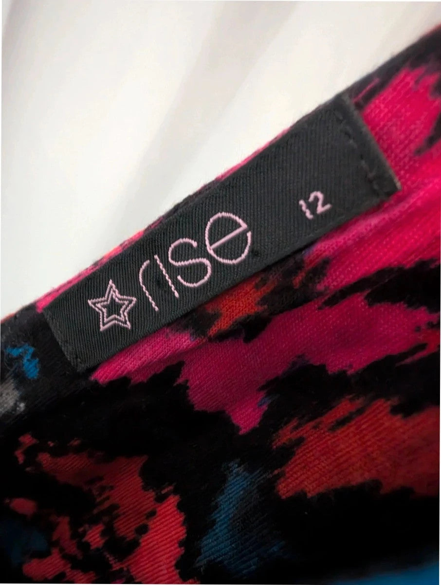 Rise black linen maxi dress with vibrant pink floral print and twist front V-neck.
