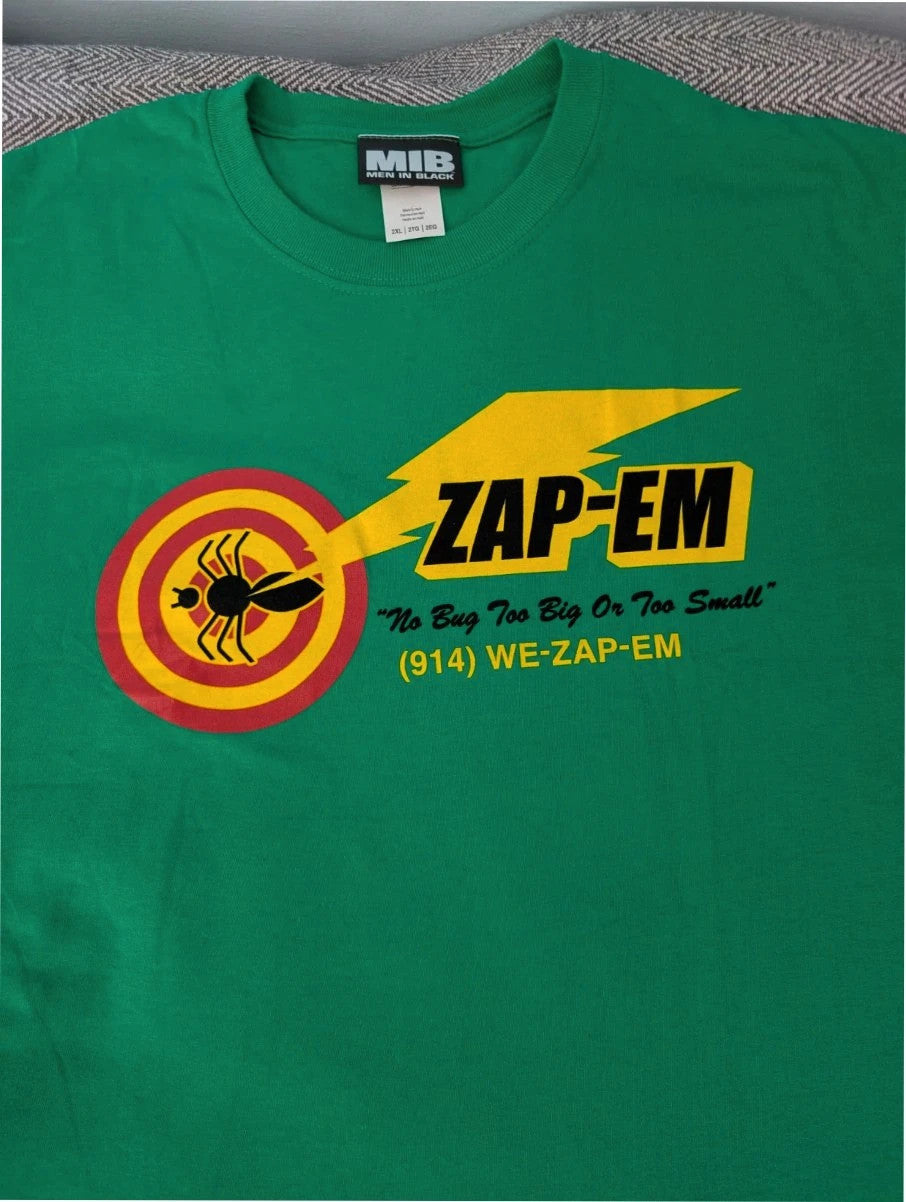 Gildan green graphic tee featuring Men In Black "Zap-Em Exterminators" logo and slogan.