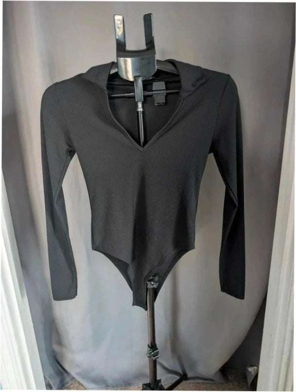 Select black ribbed long sleeve collared bodysuit with deep v-neck and popper fastenings.