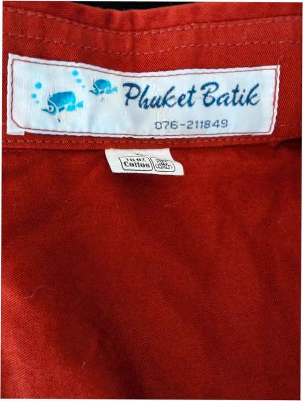 Phuket Batik burgundy graphic tee with hand-painted dolphins and commemorative embroidered pocket.
