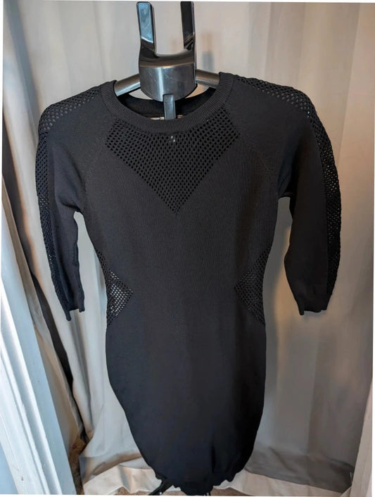 Blue Vanilla black bodycon mini dress with mesh cutouts and ribbed neckline.