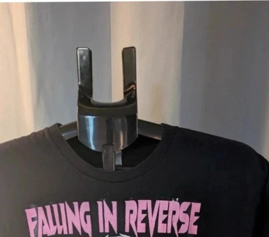 Next Level black graphic tee featuring Falling In Reverse pink logo and band portrait.
