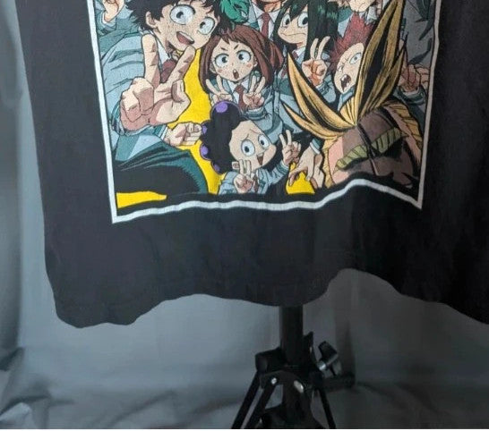 My Hero Academia black graphic tee featuring vibrant comic art panel and dual language title.