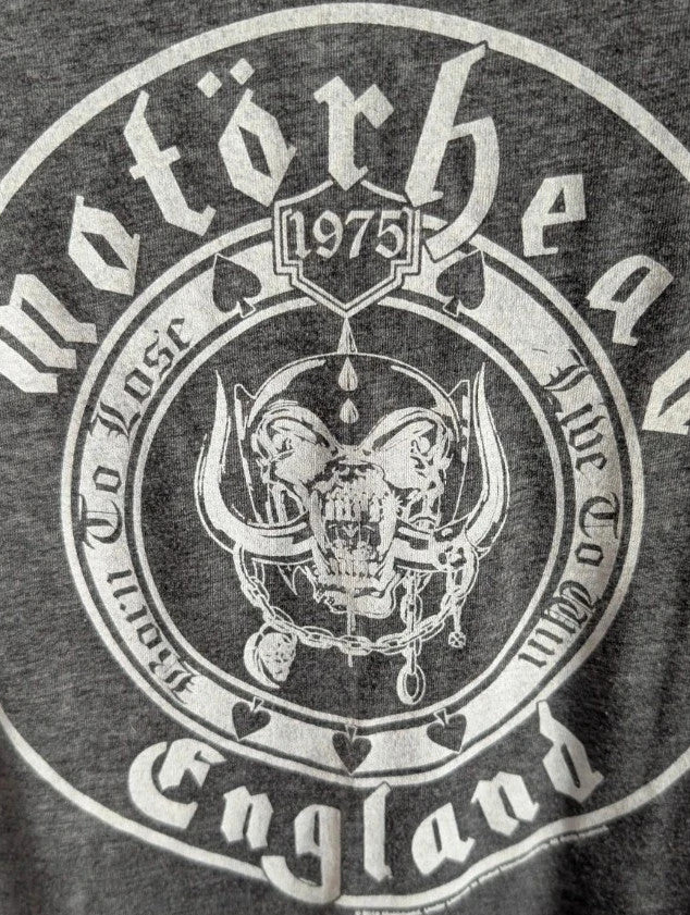 Motörhead grey graphic tee featuring Snaggletooth Warpig emblem and circular print.