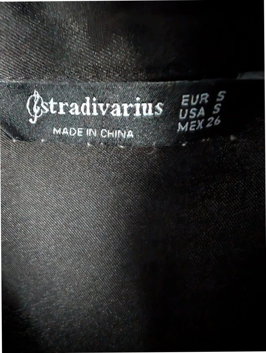 Stradivarius black satin pencil dress with twist front, collared V-neck, and long sleeves.