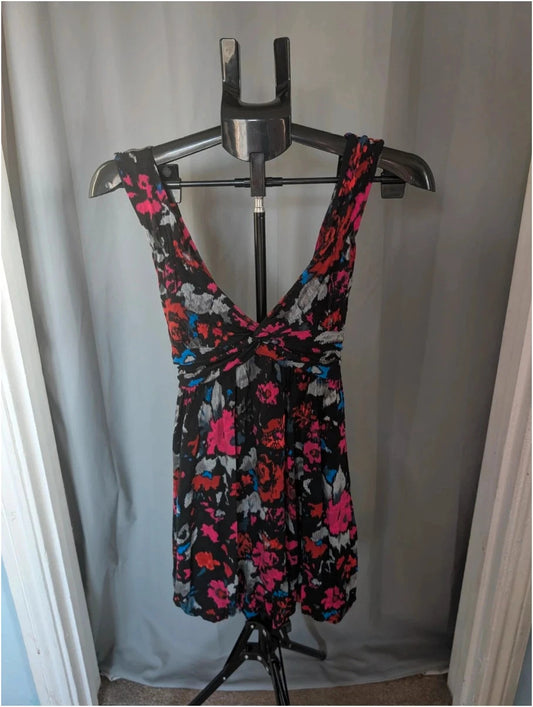 Rise black linen maxi dress with vibrant pink floral print and twist front V-neck.