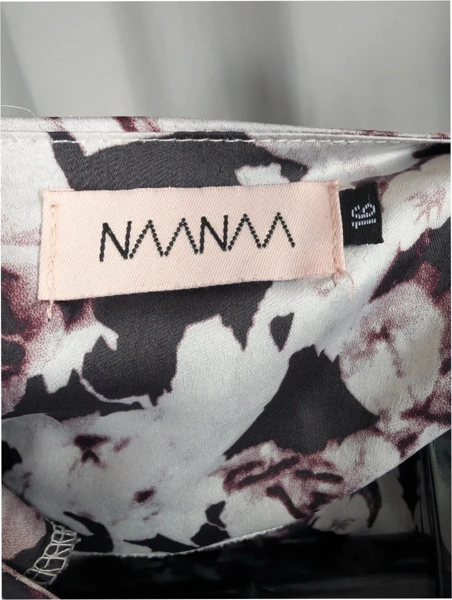 NaaNaa black satin crop top with floral print and eyelash lace trim.