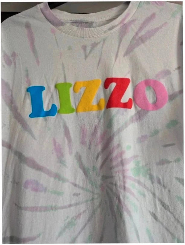 Lizzo Official Merch graphic t-shirt, white with pastel tie-dye and foam puff print logo.