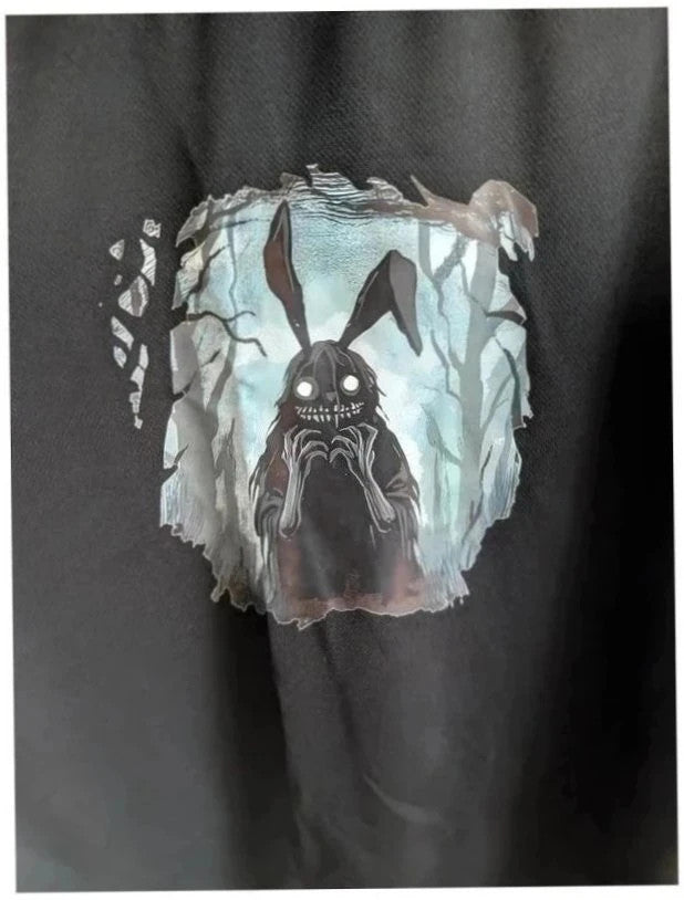 Alternative black graphic tee with creepy bunny illustration and crew neckline.