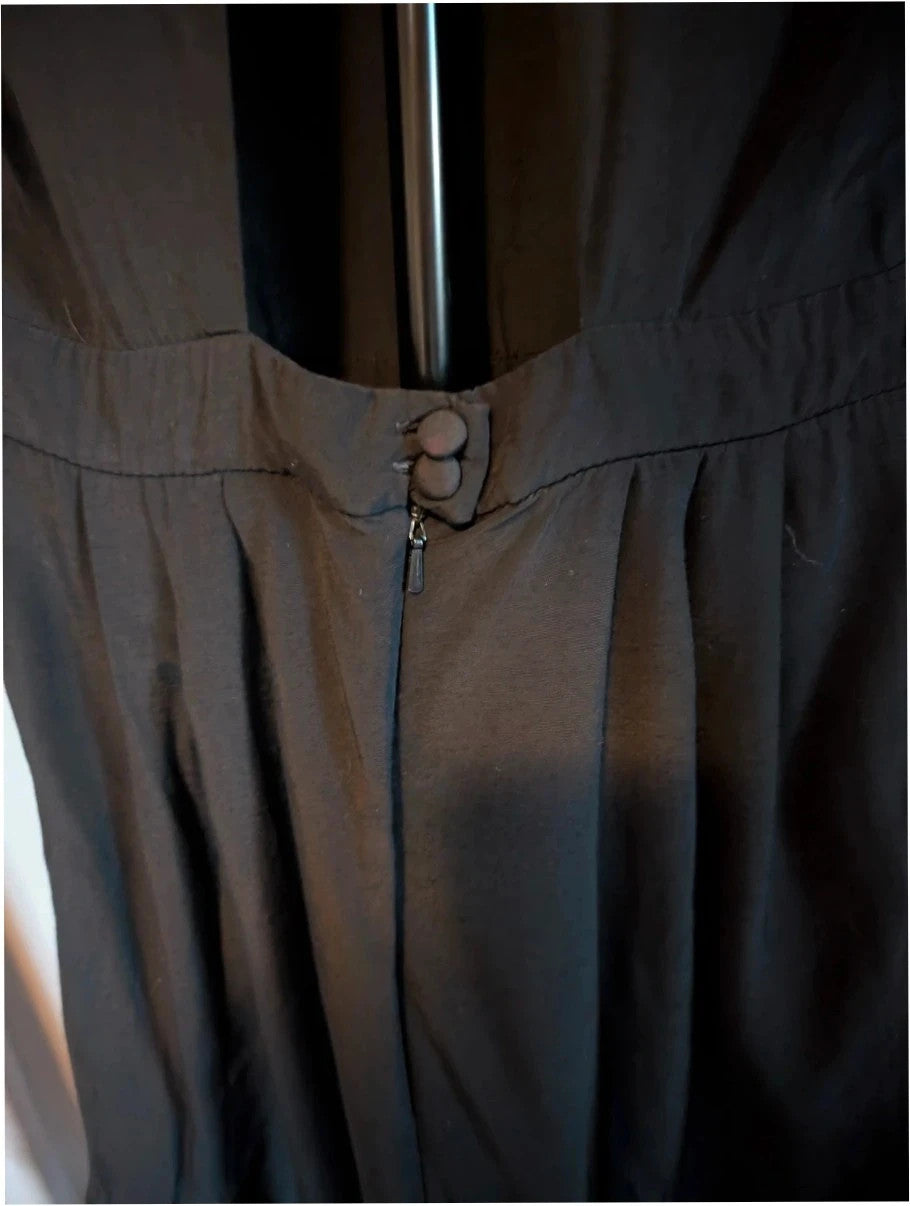 Miss Selfridge black pencil dress with cutout back and button loop fastenings.
