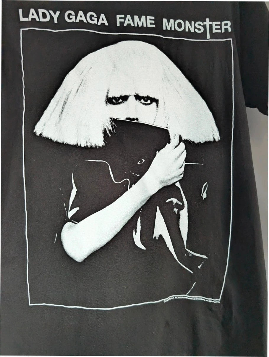 Lady Gaga black graphic t-shirt with white 'Fame Monster' print and crew neck.
