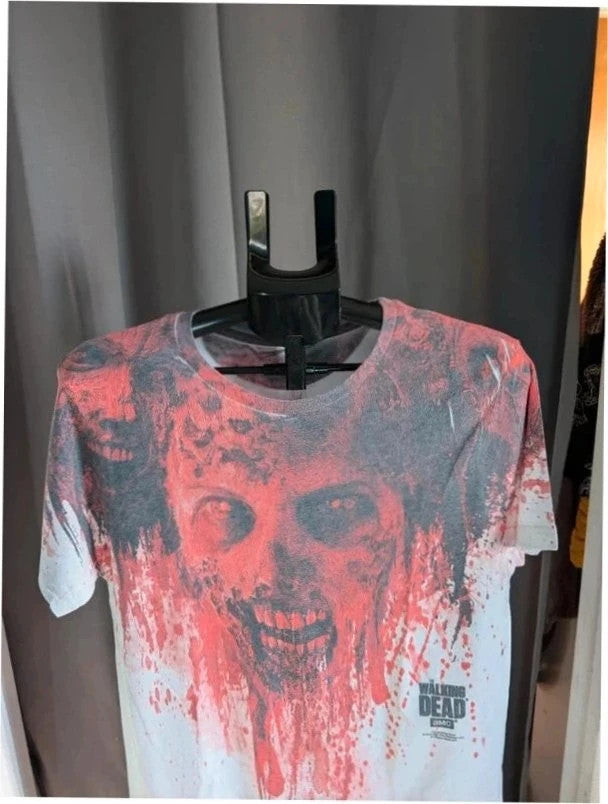 AMC The Walking Dead red and white graphic t-shirt featuring bold zombie face print.