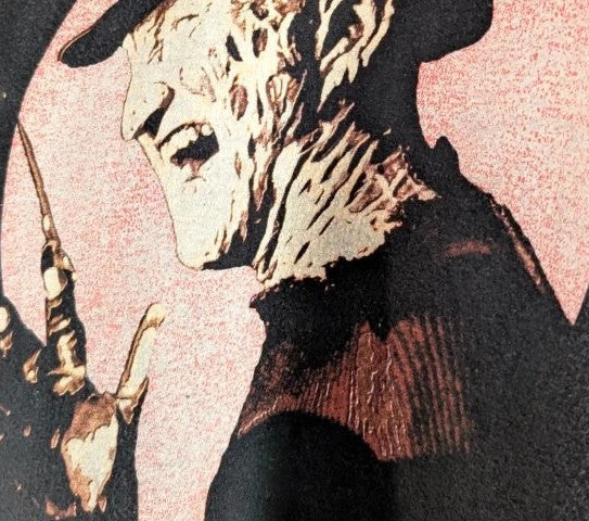 Gildan black graphic tee featuring Freddy Krueger print, soft 100% cotton material.